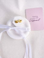 Small flower-shaped stud earrings in gold-tone stainless steel