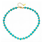 Necklace with turquoise stones and 18-karat gold-plated steel beads.