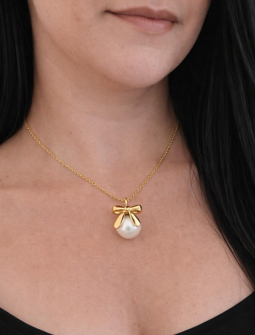 Bow + white pearl pendant necklace