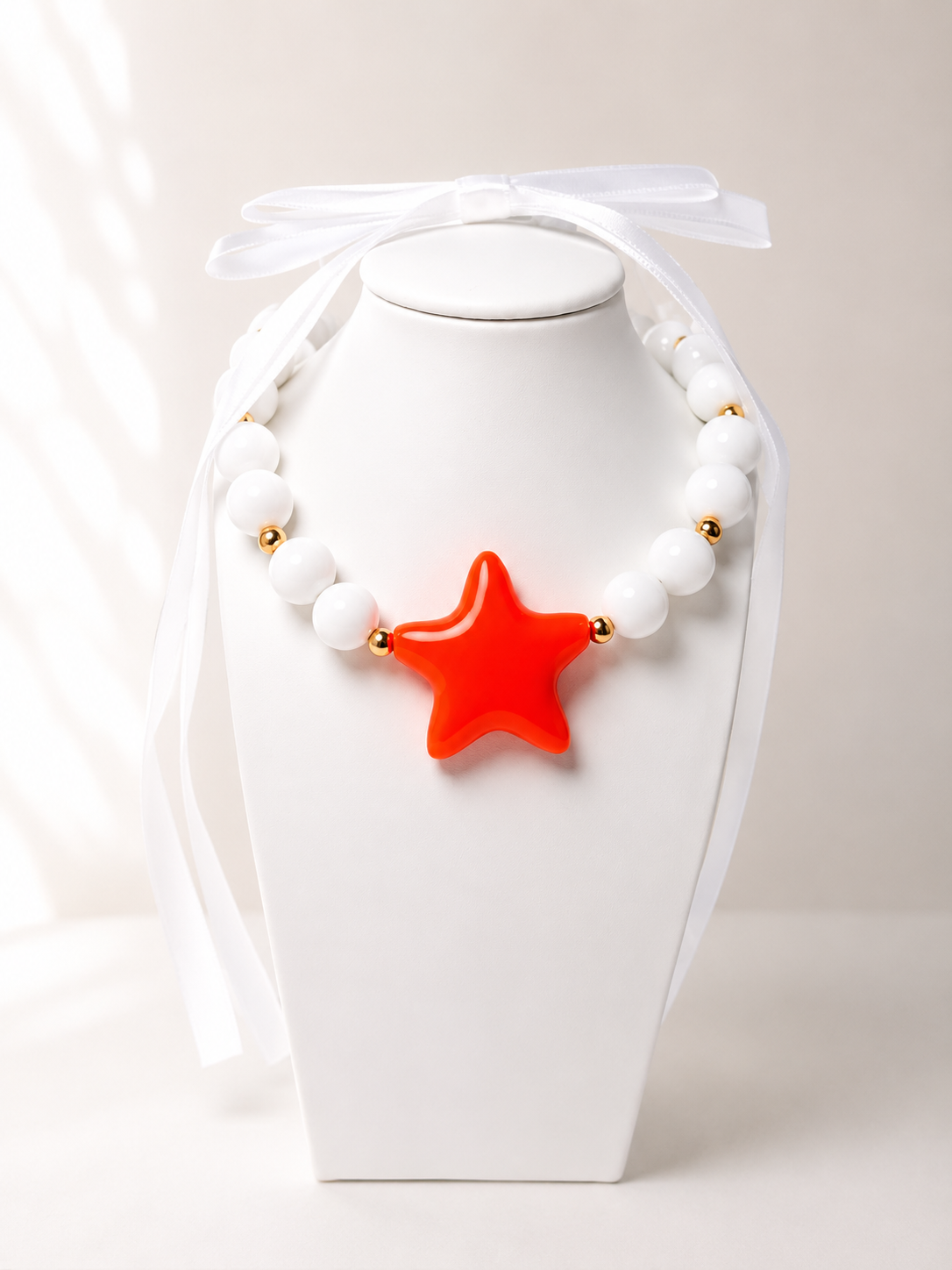 Ball and star necklace