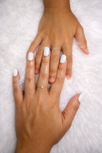 Adjustable ring with a white stone and gold plating
