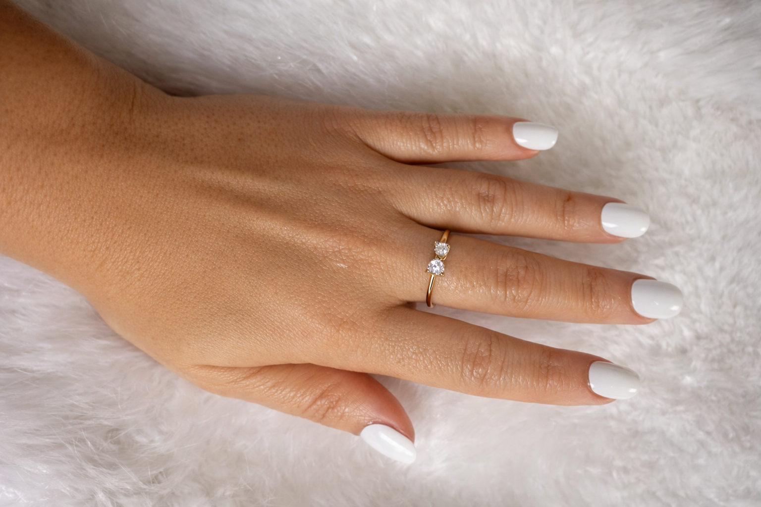 Open gold ring featuring a 9x5 mm bow design and a white zirconia inlay.