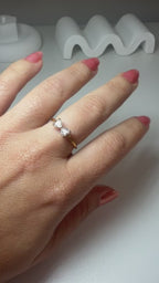 Open gold ring featuring a 9x5 mm bow design and a white zirconia inlay.
