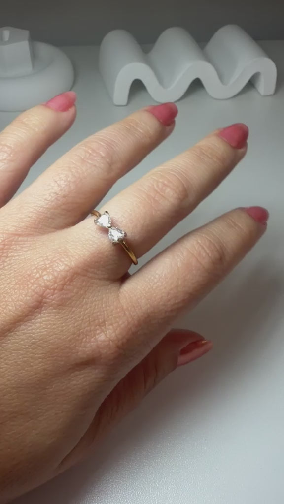 Open gold ring featuring a 9x5 mm bow design and a white zirconia inlay.
