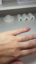 Adjustable ring with a white stone and gold plating