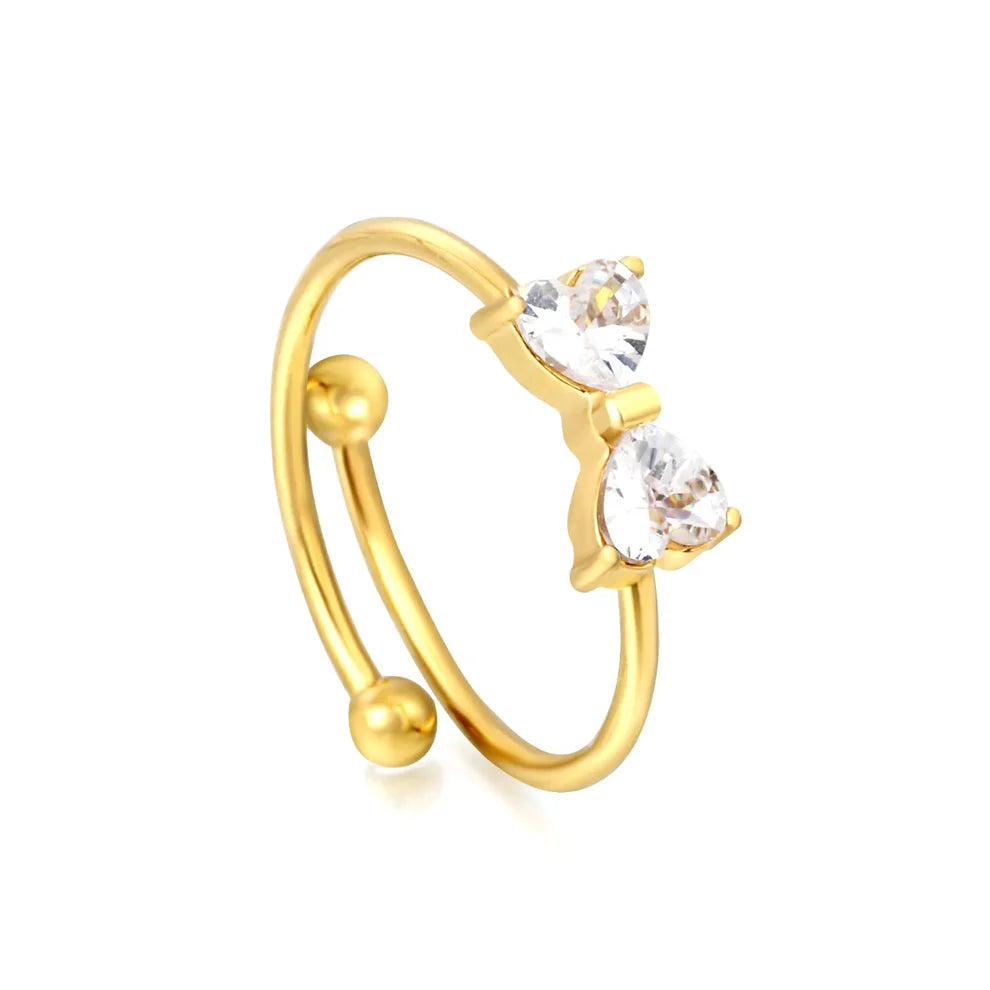 Open gold ring featuring a 9x5 mm bow design and a white zirconia inlay.